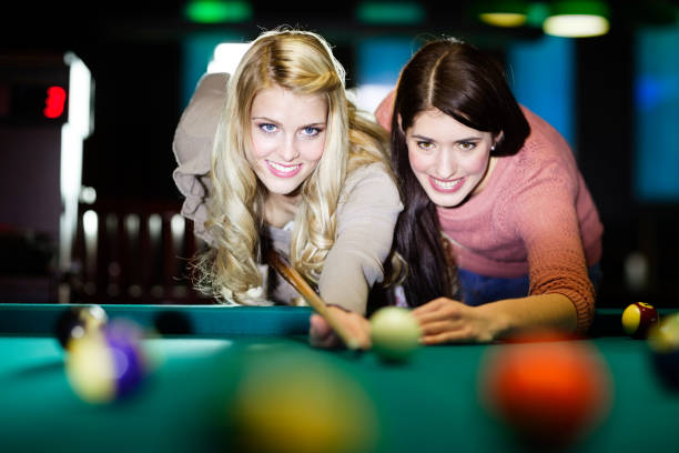 istock friends playing billiard snooker 172426419