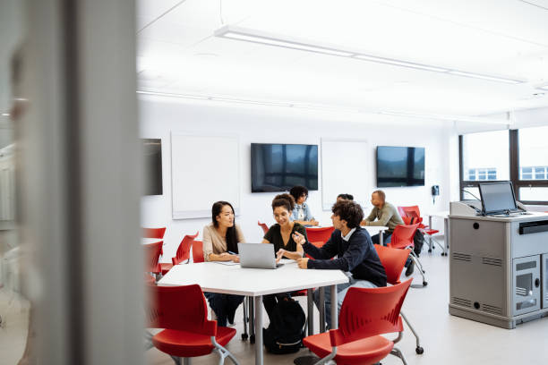 istock Young researchers in classroom, working together, using laptop and internet for scientific research 1724265098