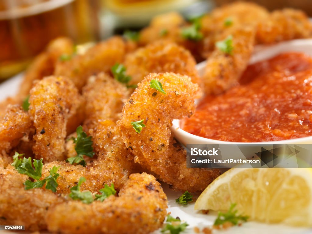 PopCorn Shrimp "PopCorn Shrimp with fresh Parsley, Lemon,Cocktail Sauce and a Couple of Beers- Photographed on Hasselblad H3D2-39mb Camera" Shrimp - Seafood Stock Photo