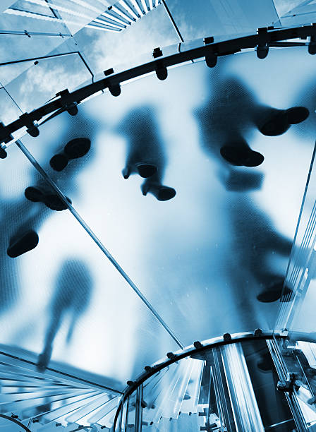 istock Silhouette people on glass staircase 172426809