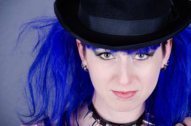 istock Smiling woman with blue hair in top hat. 172427111