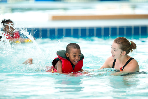 Young kids learning to swim