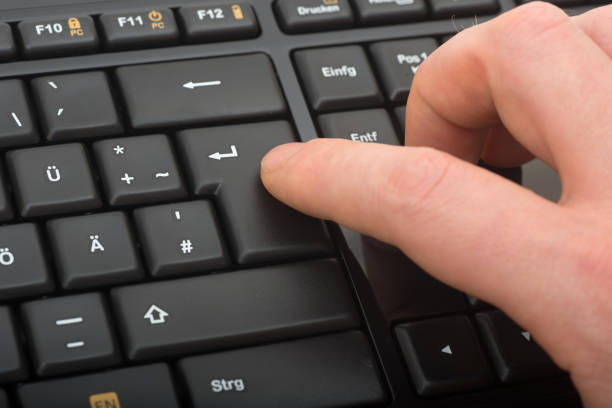istock black keyboard macro close-up with fingers 172427350