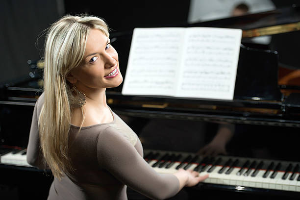 Female pianist turning towards the camera