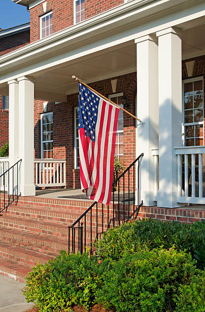 istock American flag hanging off porch column 172428235