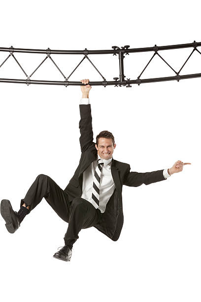 istock Businessman hanging with a metal structure 172429123
