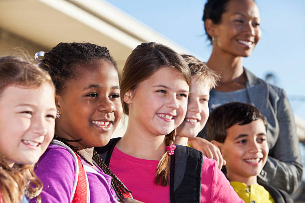 istock Group of elementary school children with teacher 172429169