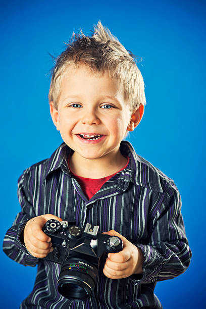 istock Little boy with vintage camera 172429189