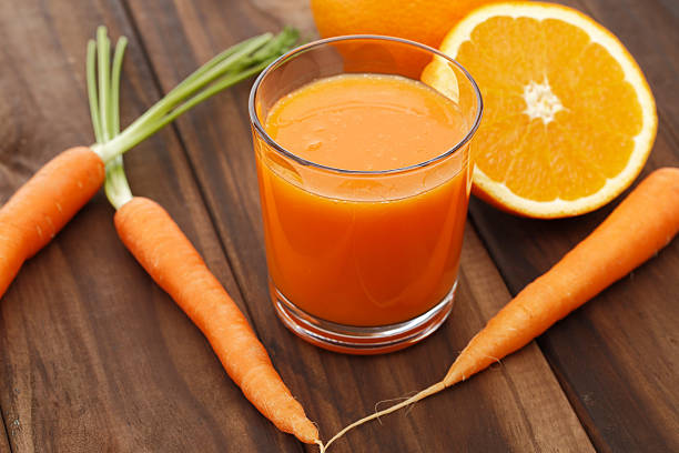cenoura e suco de laranja - carrot juice - fotografias e filmes do acervo