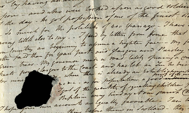 istock Part of old letter with hole 172429329