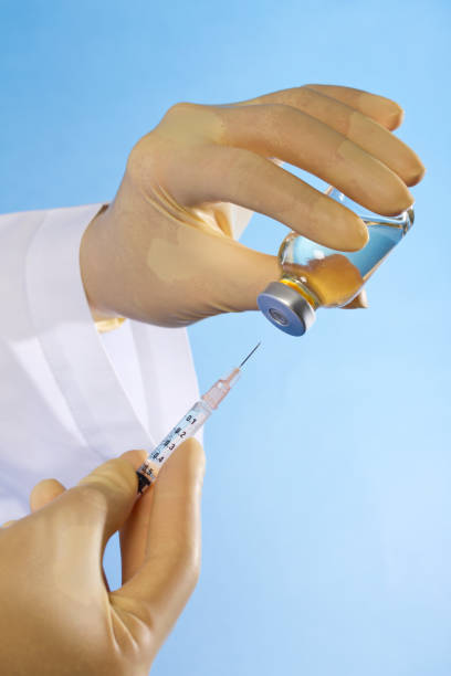istock Nurse preparing a syring for injection 172429383