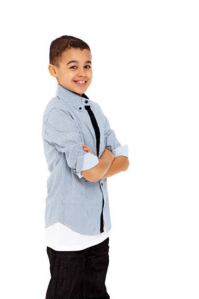 istock Smiling young child with arms crossed standing on white 172430147