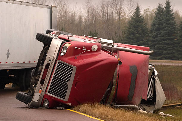 istock Truck crash with turned over semi 172430430