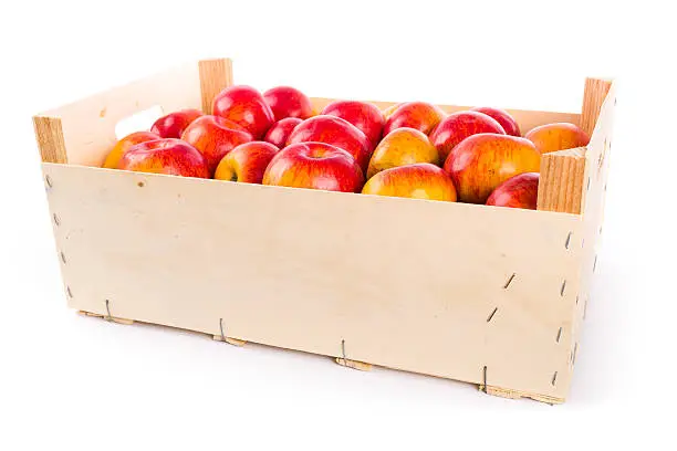 "delicious red-yellow apples in a big wooden crate, on white backgroundsee my"