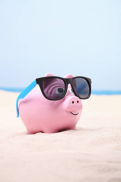 istock Piggybank at the beach 172431231