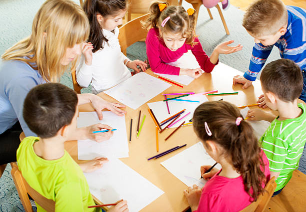 istock Teacher drawing with children. 172431740