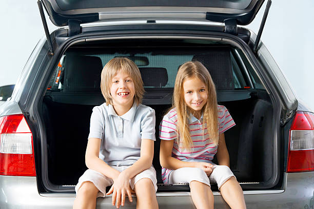 istock Children sitting in a car trunk. 172431955