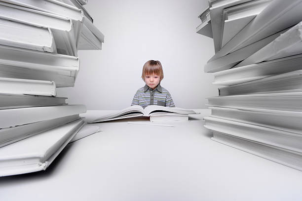 istock Young boy bored and frustrated with his homework 172432231