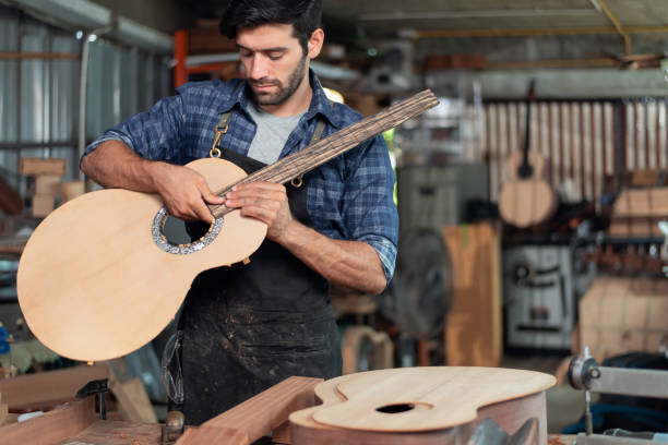 istock Luthier making wooden musical and using traditional tools in workroom with manual tools 1724322888