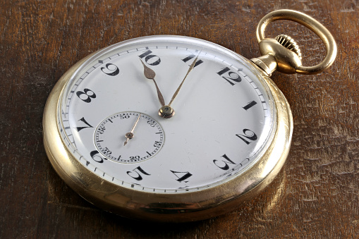 Vintage Old Pocket watch on snowy background