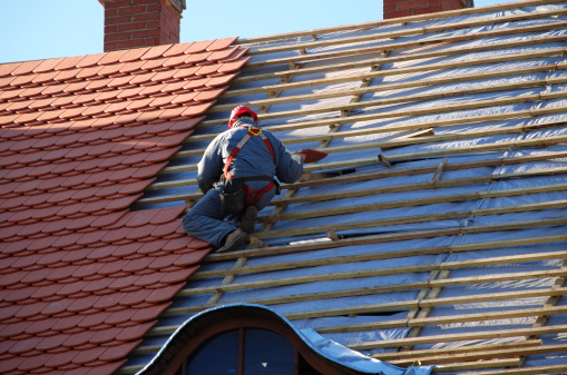 carpenter working on the roof