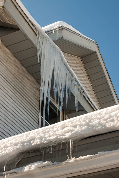 istock Wintery Icicles on Old House 172432931