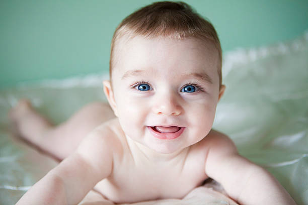 Beautiful baby boy with blue eyes stock photo
