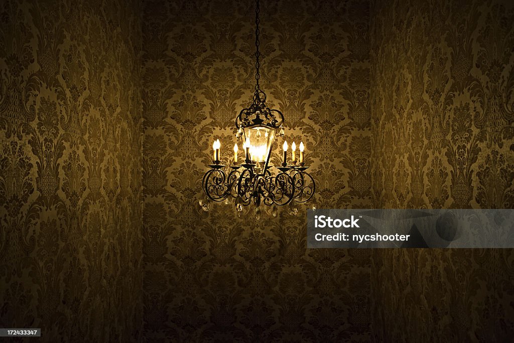 Chandelier mystery Chandelier set against damask wallpaper wall.  Some HDR added for pop. Backgrounds Stock Photo