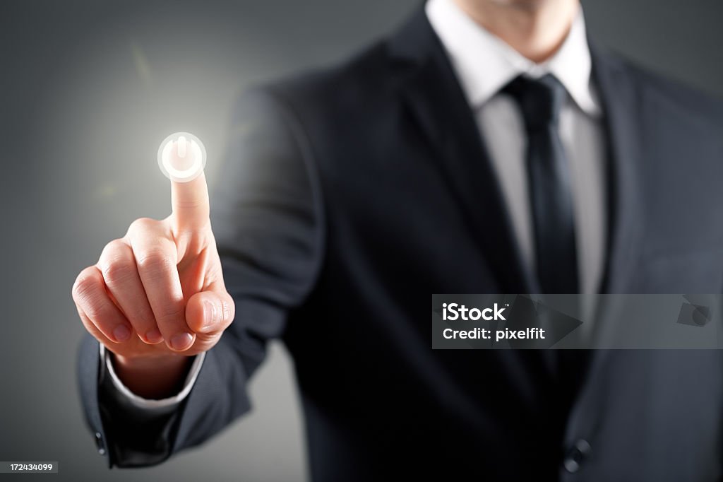 Businessman pressing button on touch screen Touch screen interface with copy space Adult Stock Photo