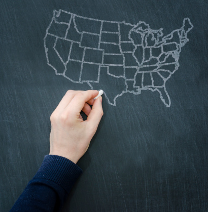 chalkboard concept: usa map draw with a chalk on a blackboard.