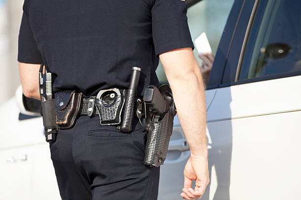istock Police officer giving a ticket 172434287