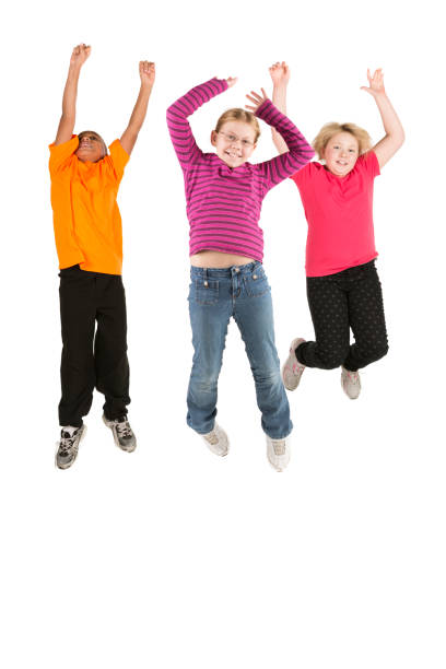 istock Three happy diverse kids jumping on white 172434396