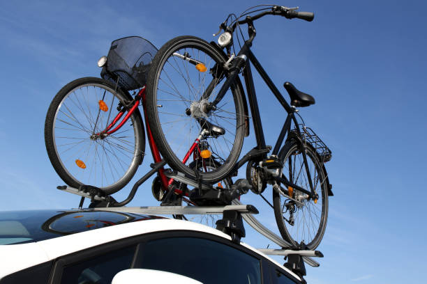 istock bicycle rack on top of white car 1724344338