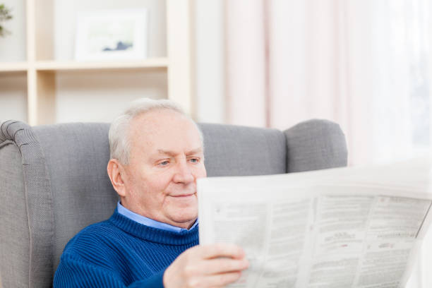 istock Senior man with newspaper 172434481