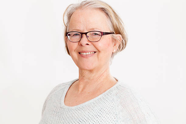istock smiling senior woman with eyeglasses 172434754