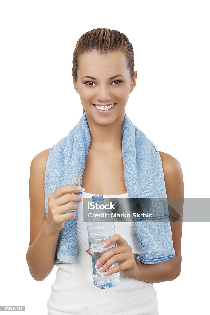 Fitness donna con bottiglia e asciugamani - Foto stock royalty-free di Abbigliamento sportivo