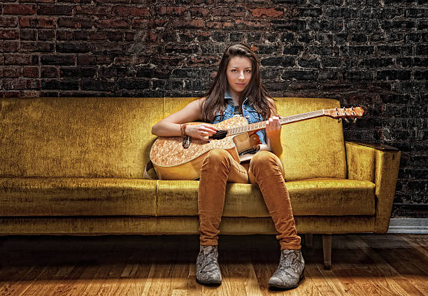 girl strumming guitar