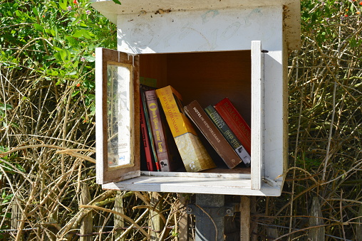 Ostend, West-Flanders, Belgium - October 1, 2023: This is new. In the streets of Ostend you find wooden boxes where people left for free books and other stuff. Public gift box