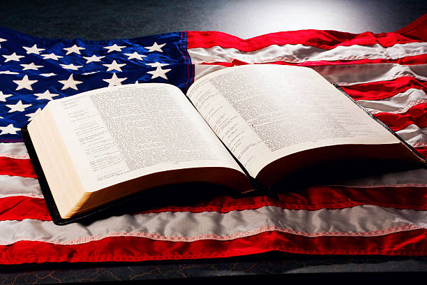 istock King James Bible - Open on US Flag 172435288