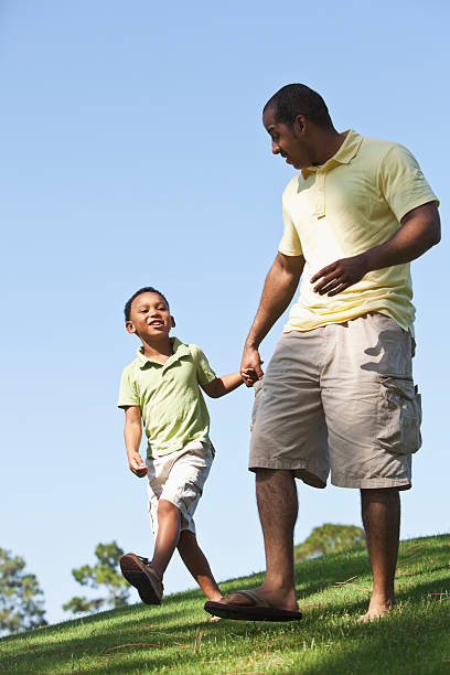 istock Father and son walking, holding hands 172435438