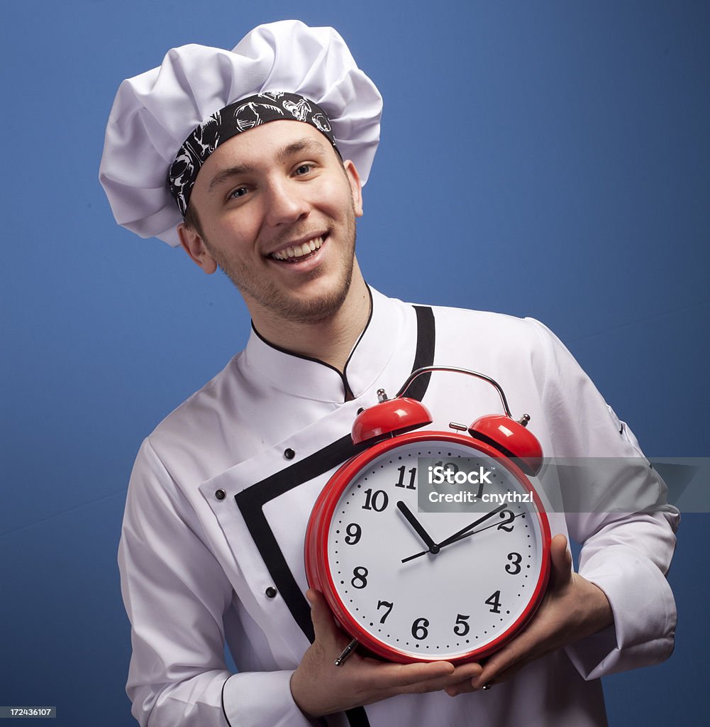 Chef tenendo sveglia - Foto stock royalty-free di Humour