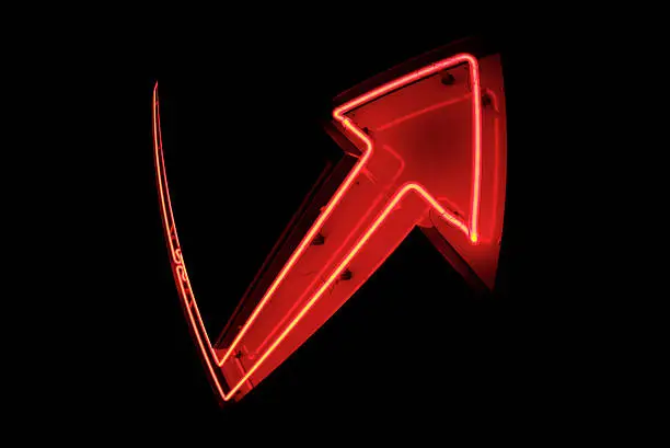 Neon arrow sign showing a jumbo reversal of fortune
