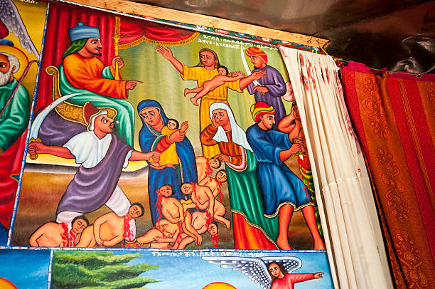 Herod's Massacre of the Innocents in Ethiopian church Artistic representation of the Massacre of the Innocents, which refers to the slaughter of young boys in Bethlehem by Herod the Great (as recounted in the Gospel of Matthew). The artwork is on a wall inside an Ethiopian monastery church on Lake Tana near Bahir Dar, Ethiopia.More of my images from Ethiopia: ethiopian orthodox church stock pictures, royalty-free photos & images