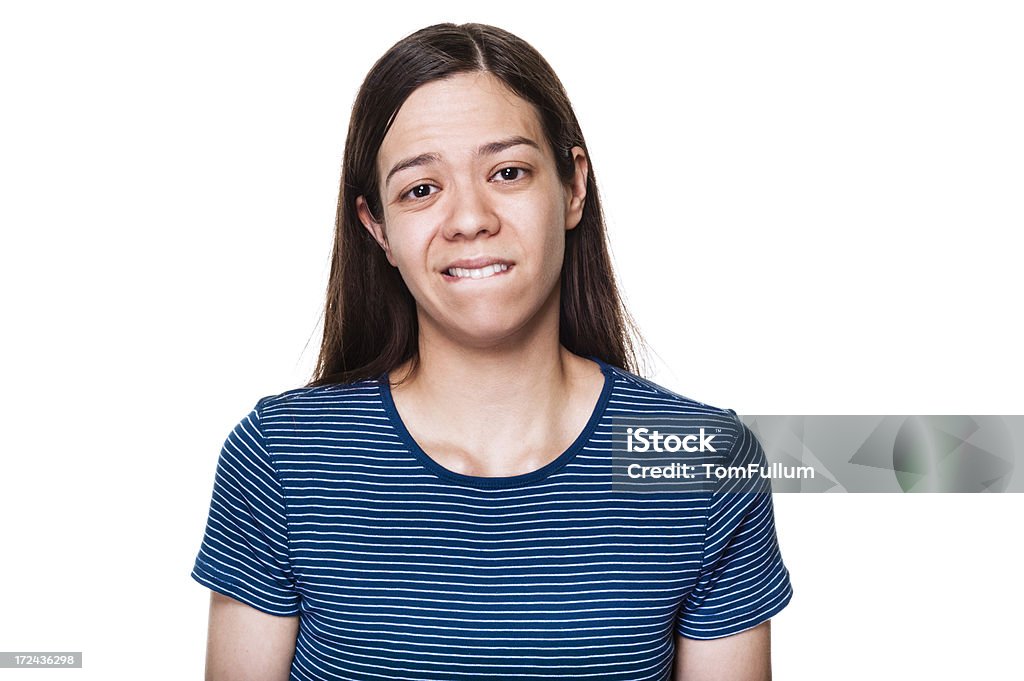 Donna Mordersi le labbra - Foto stock royalty-free di 25-29 anni