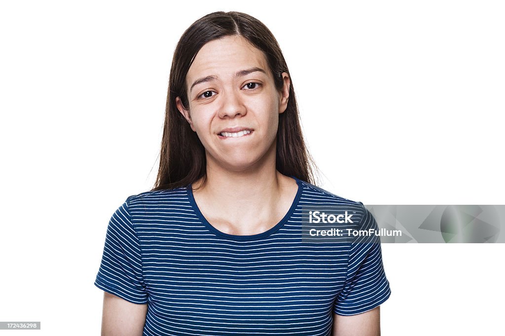 Woman Biting Lip Sad young woman against white background. 25-29 Years Stock Photo