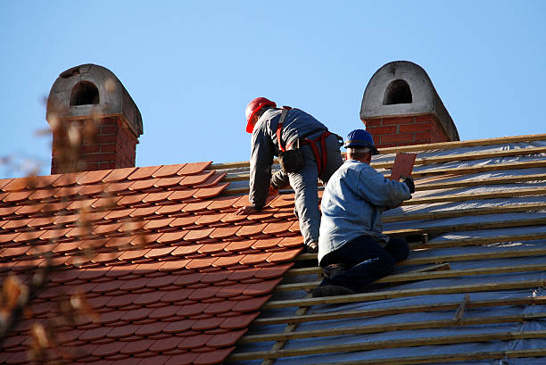 istock carpenters working on the roof 172436333