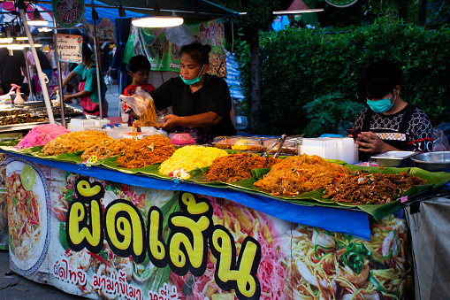 Traditional local food cooking many variety stir fried noodles for thai people travelers select buy and eat in street market bazaar of temple annual festival on October 1, 2023 in Nonthaburi, Thailand