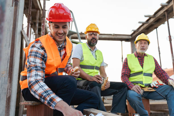istock Caucasian architect, building contractor and engineer, having an lunch break on a construction site 1724363894