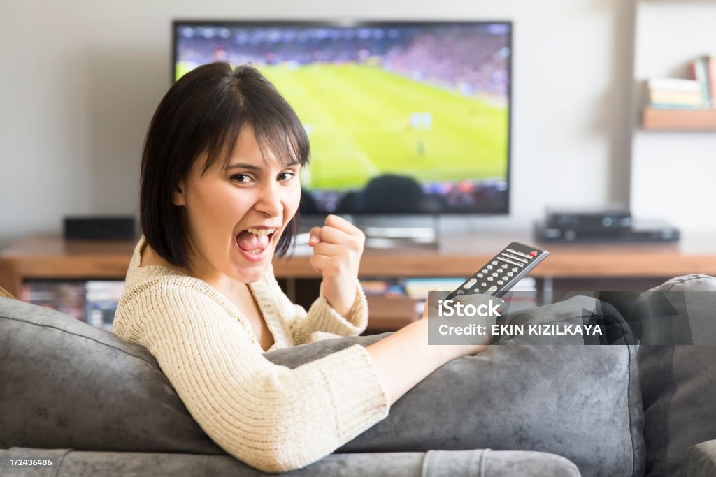 Junge Frau vor dem Fernseher - Lizenzfrei Fußball Stock-Foto