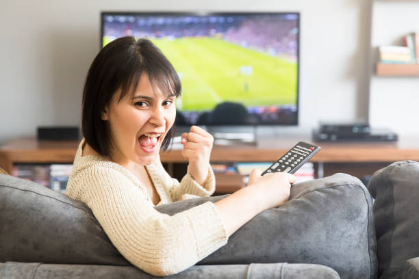 istock young woman watching television 172436486